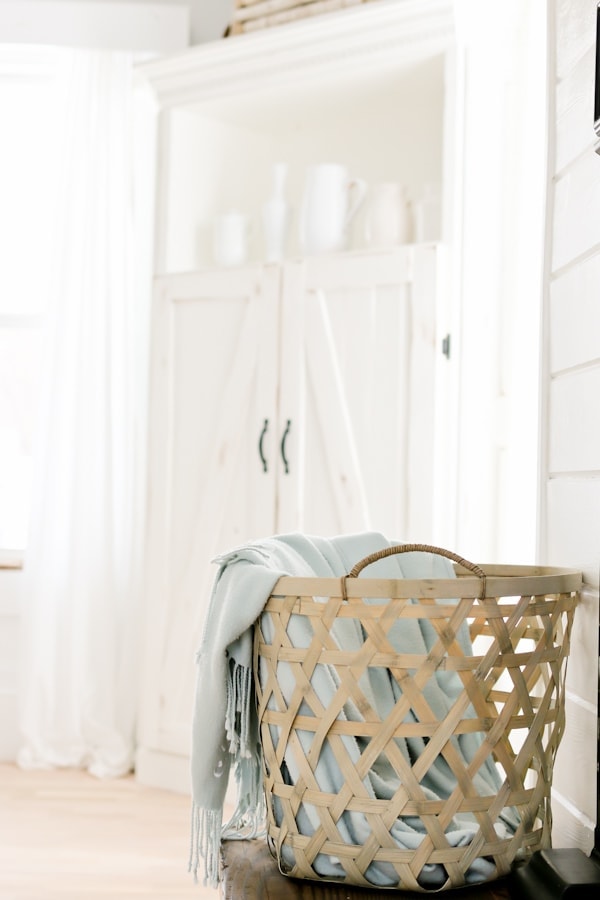 wooden laundry basket with blue blanket