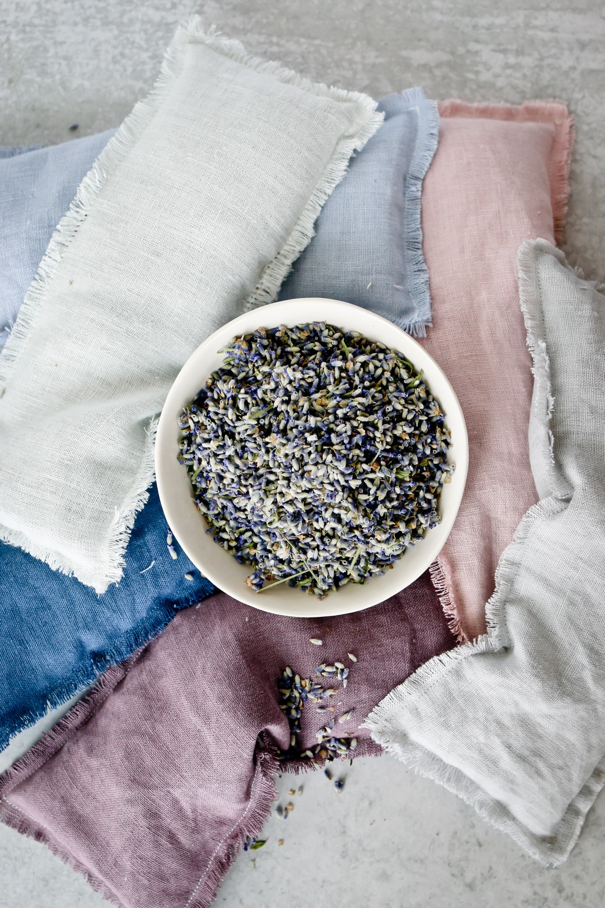 DIY Linen Lavender Eye Pillows and a bowl of dried lavender buds