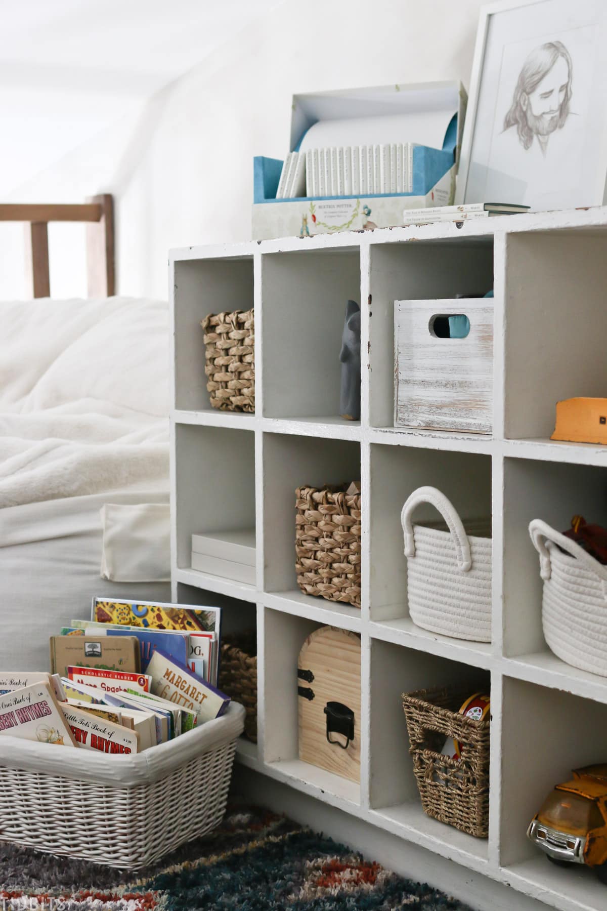 storage cubby with baskets and books on top