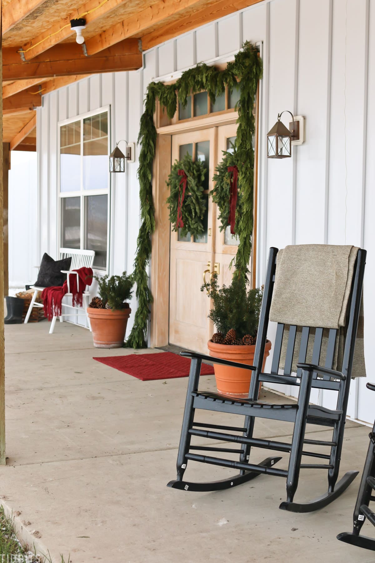 Christmas front porch with fresh greenery