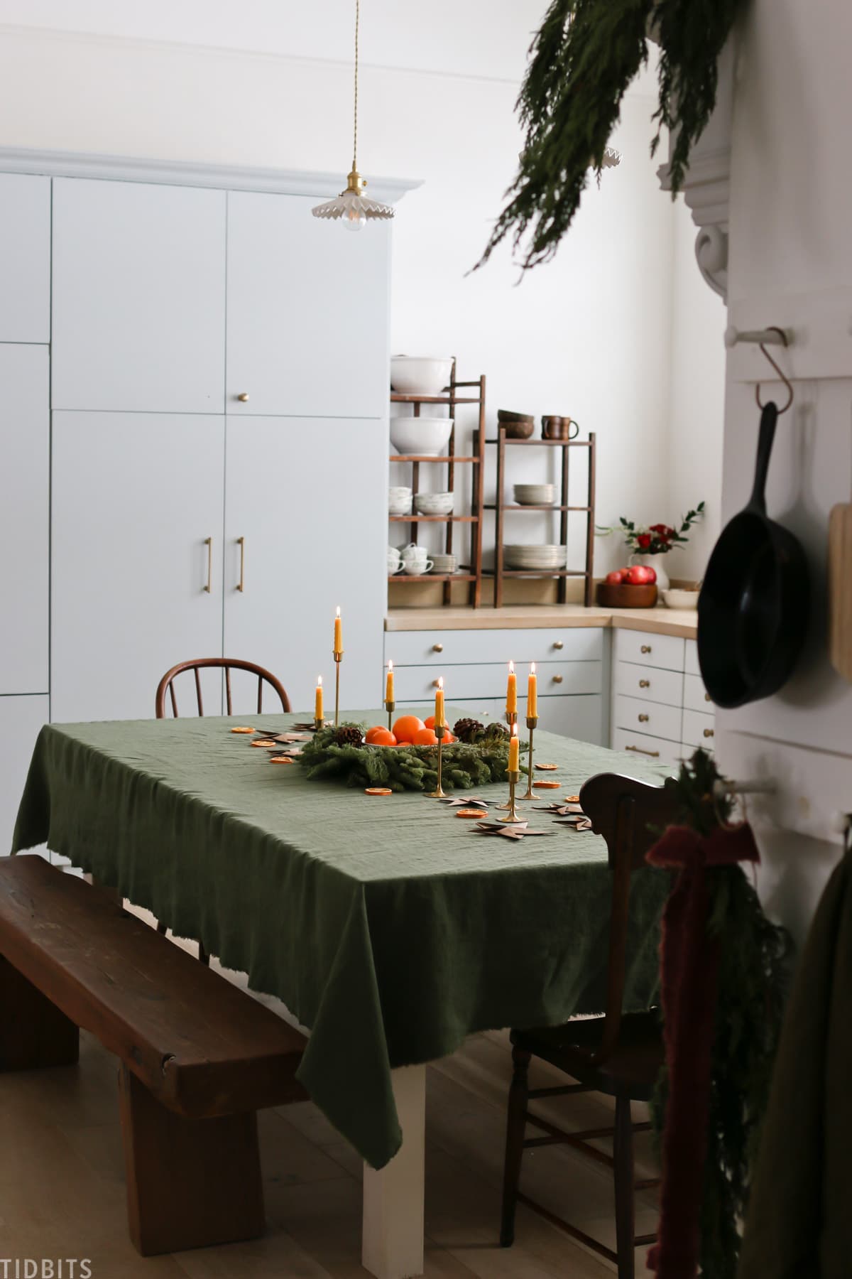 green linen tablecloth for a christmas tablescape