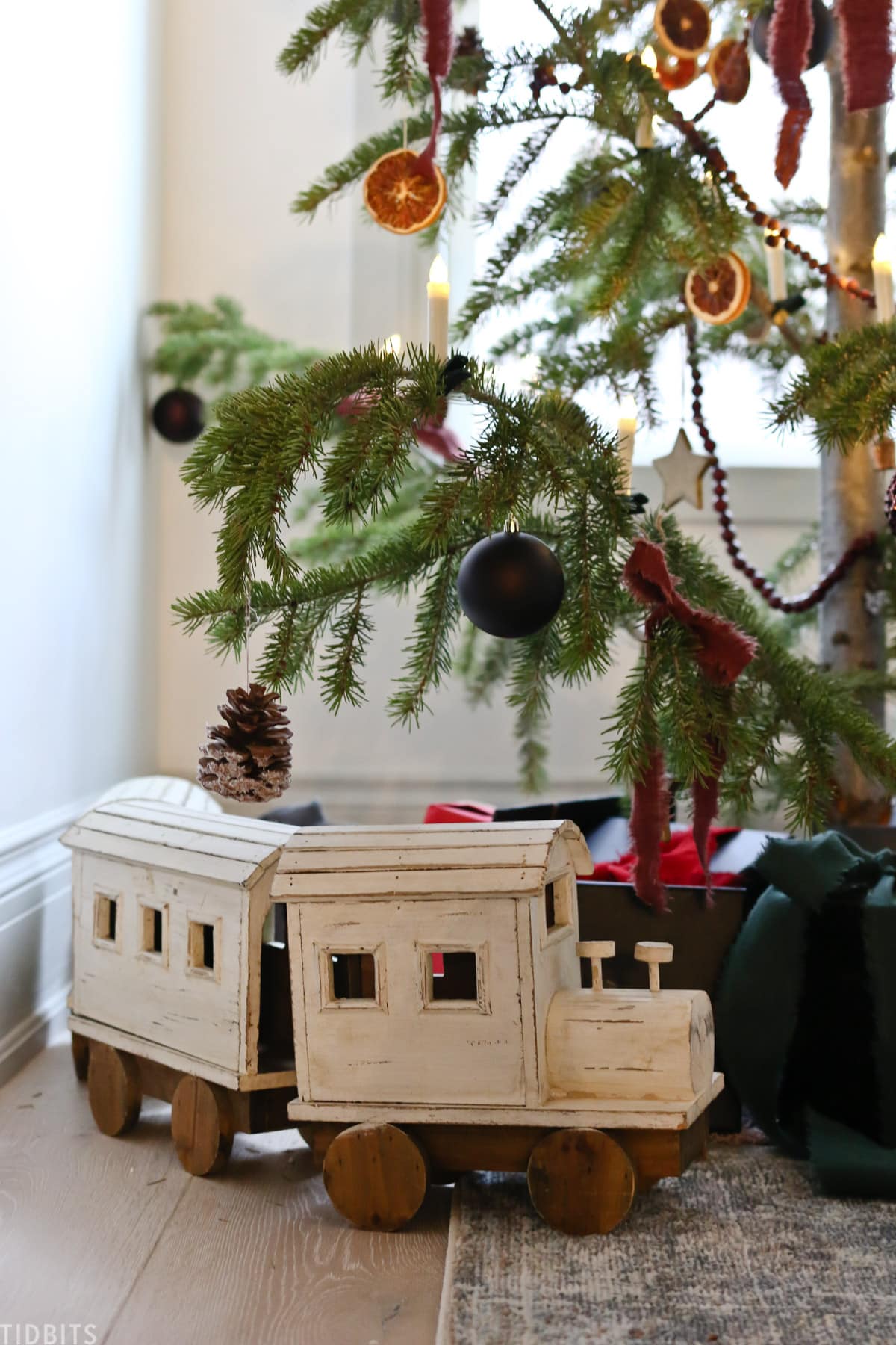 wooden train under the christmas tree