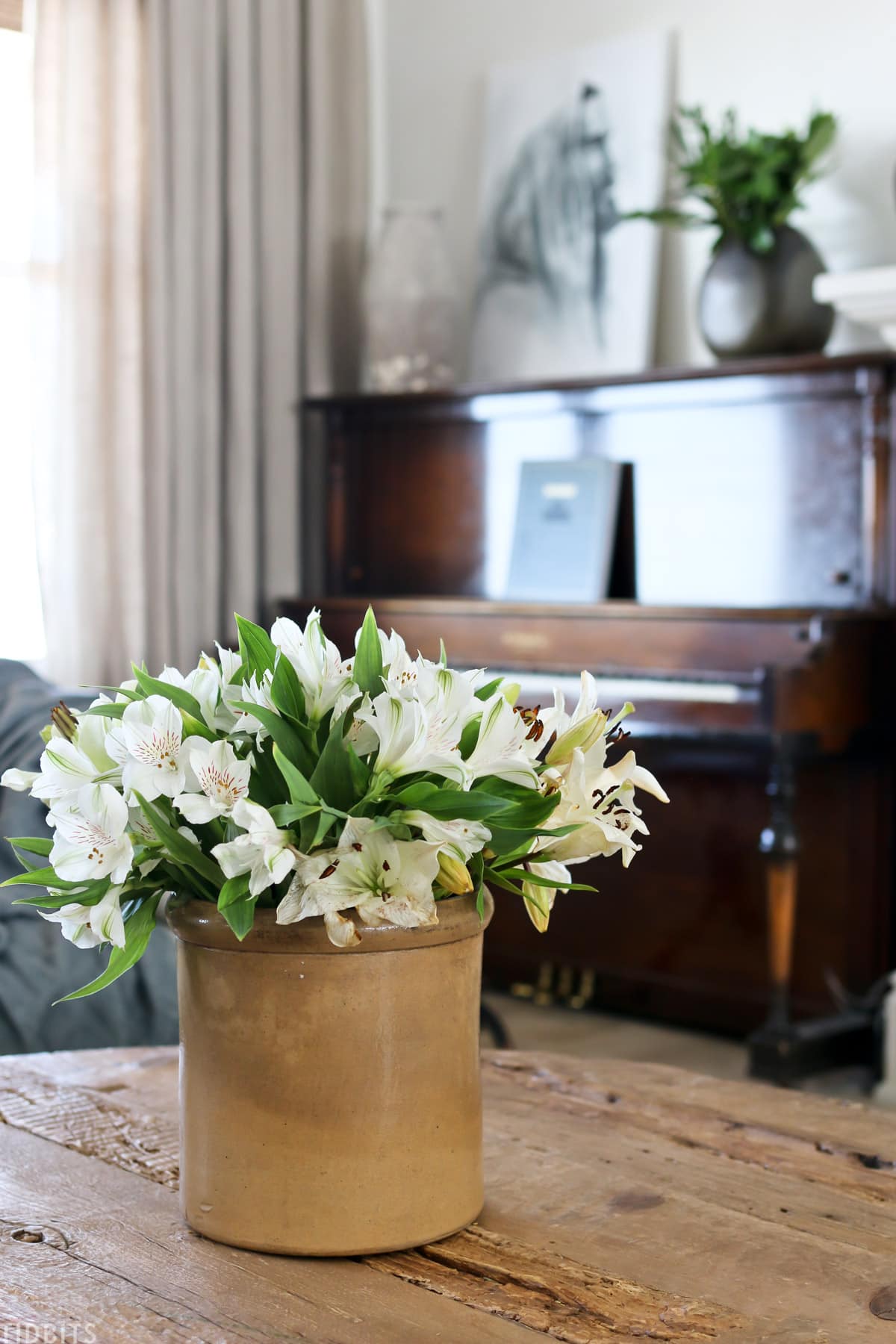 white lillies in a vintage vessel