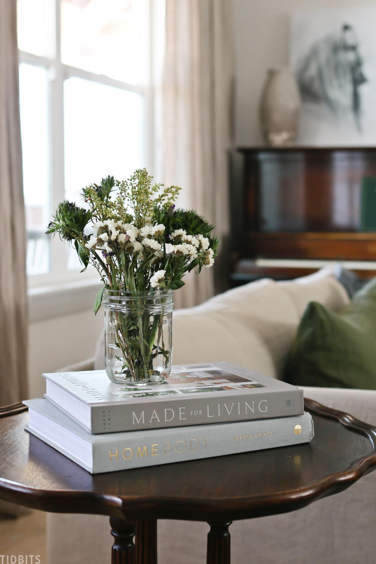 side table with books and flowers