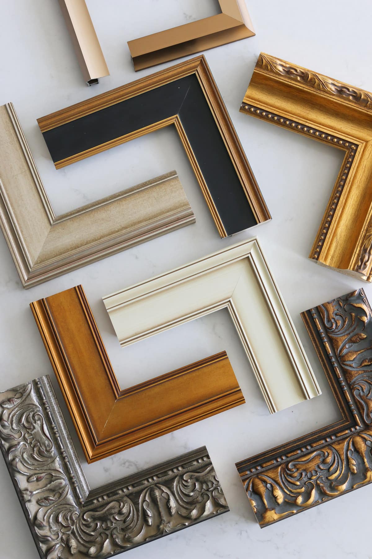several samples of Deco TV Frames laid out on countertop