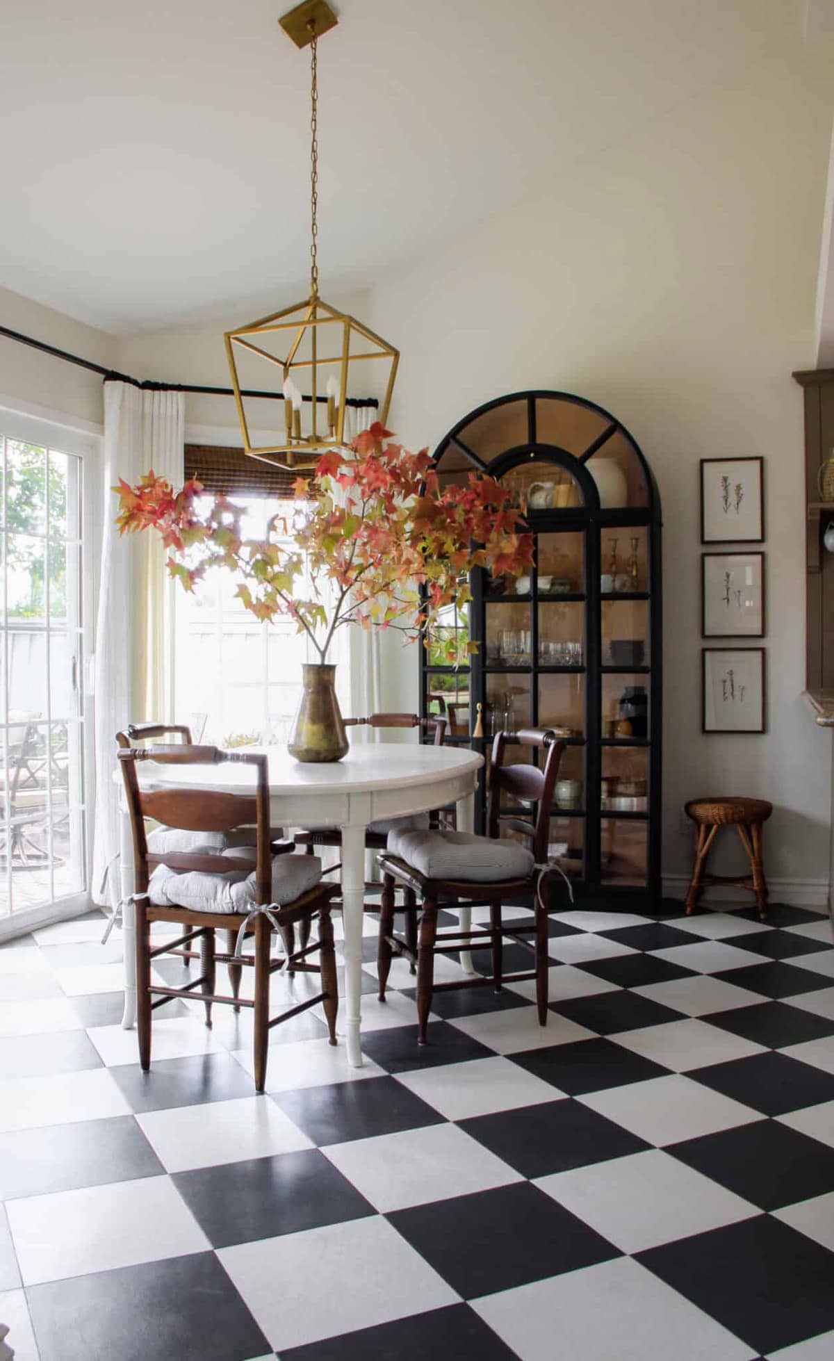 painted harlequin tile floors in a dining room