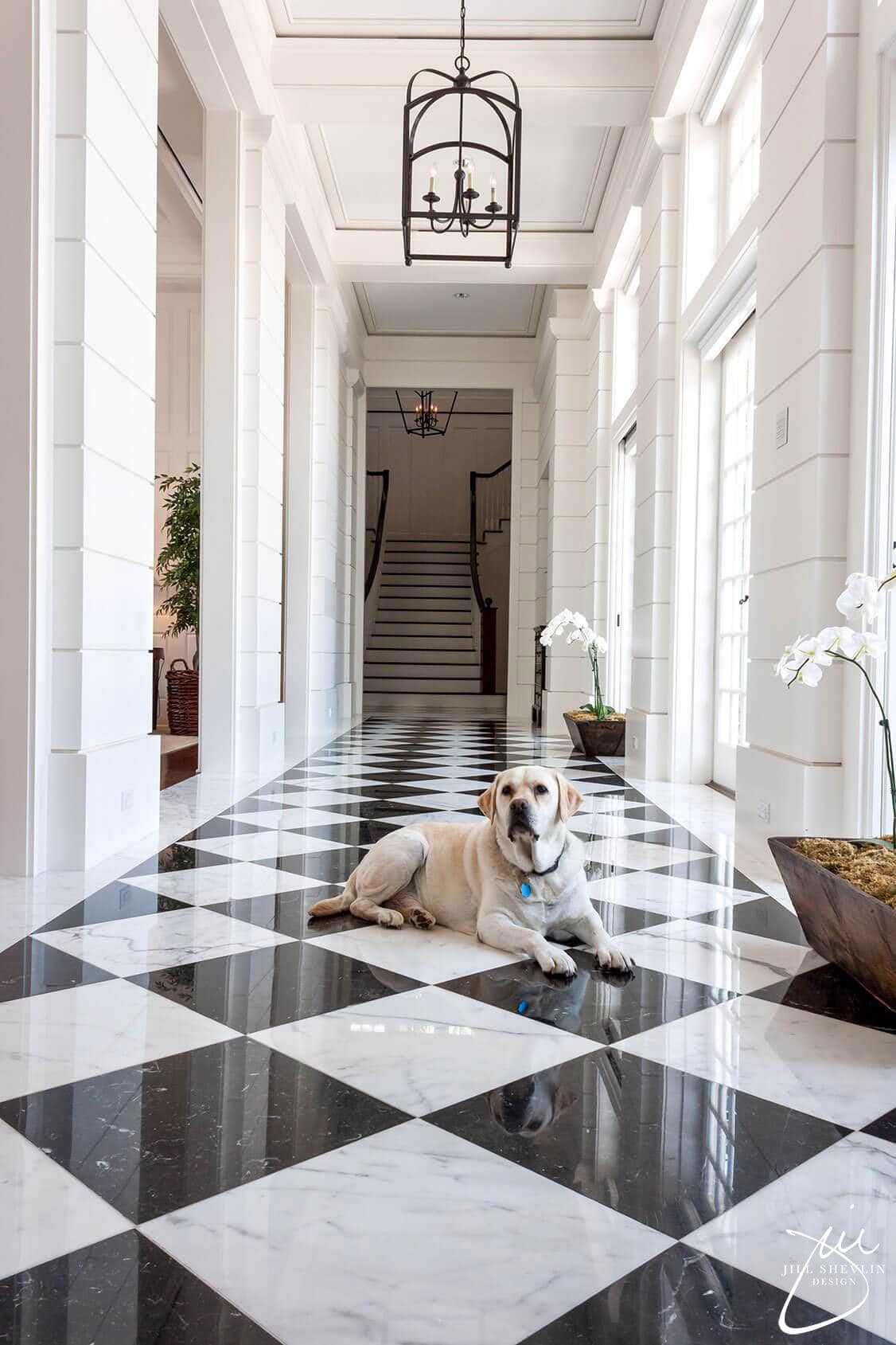 black and white checkerboard flooring with a glossy finish
