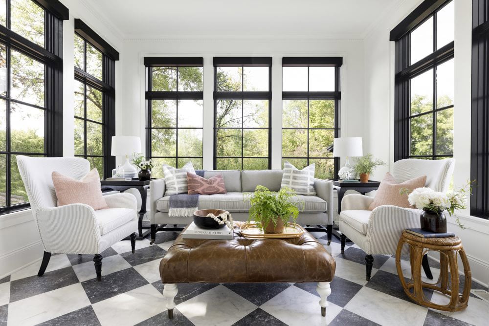 black and white diagonal floor tiling in a light and airy porch space