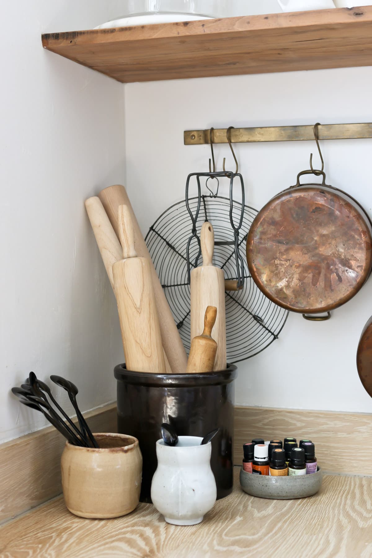 antique crocks and pottery for rolling pin and spoon storage