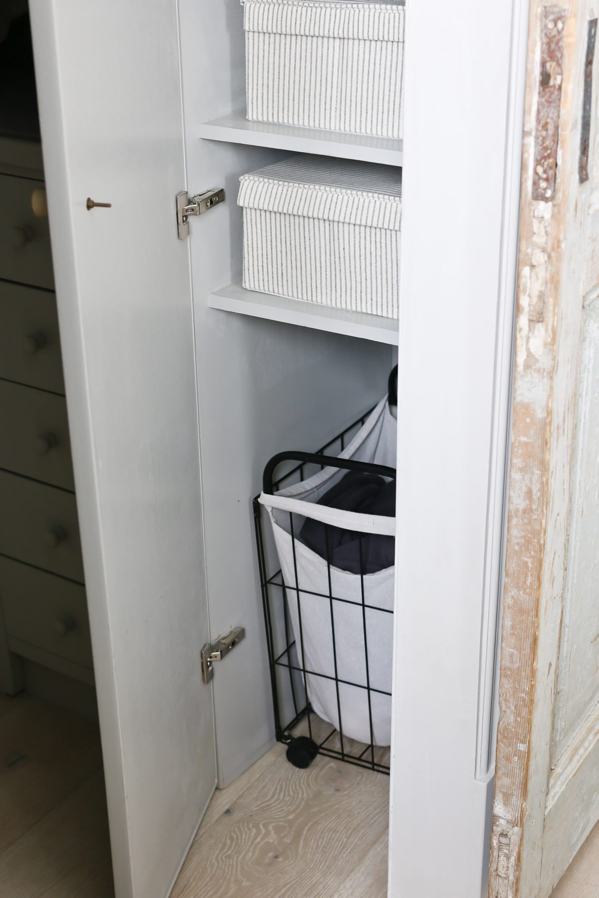 storing laundry basket in bedroom closet