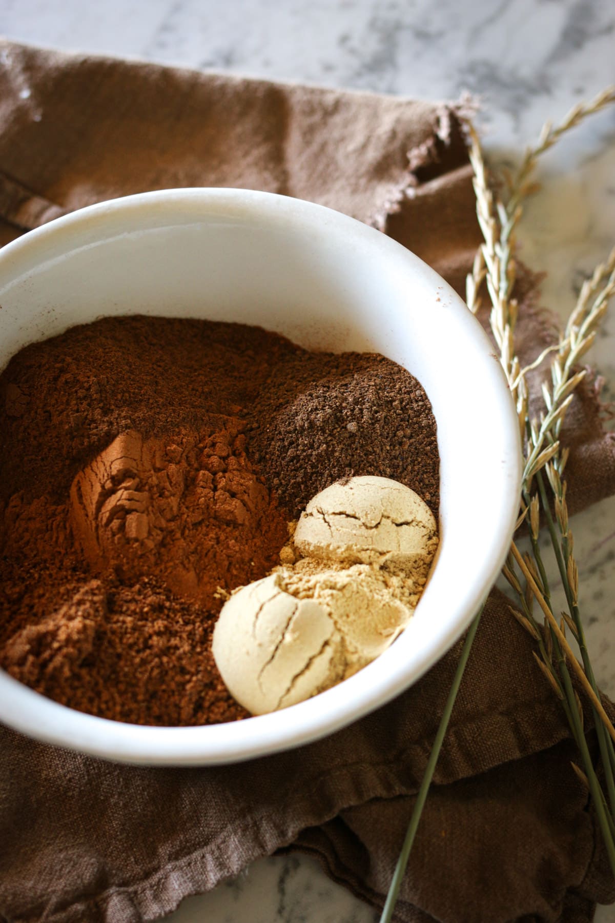 A bowl of DIY pumpkin spice. How to make your own pumpkin pie spice for Fall.