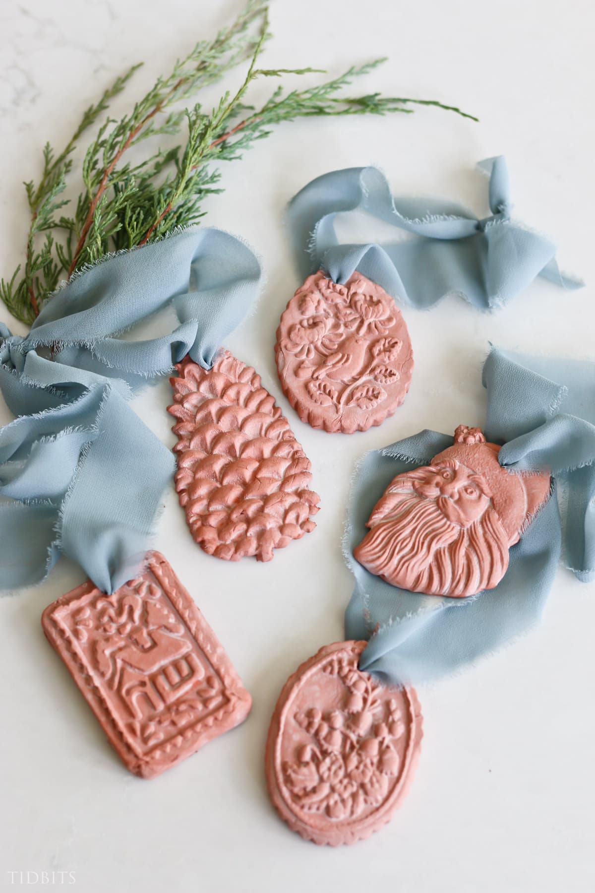 add ribbon to the terra cotta air dry clay ornaments