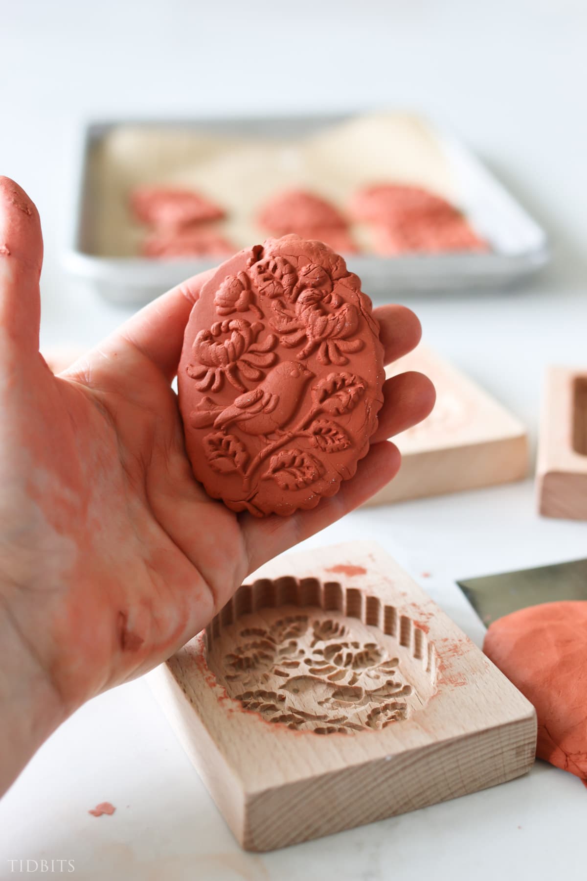step four making air dry clay ornaments - carefully lift out clay