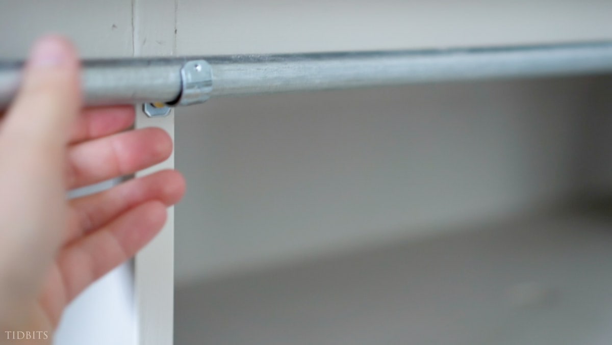 hang cabinet curtains with a EMT electrical conduit