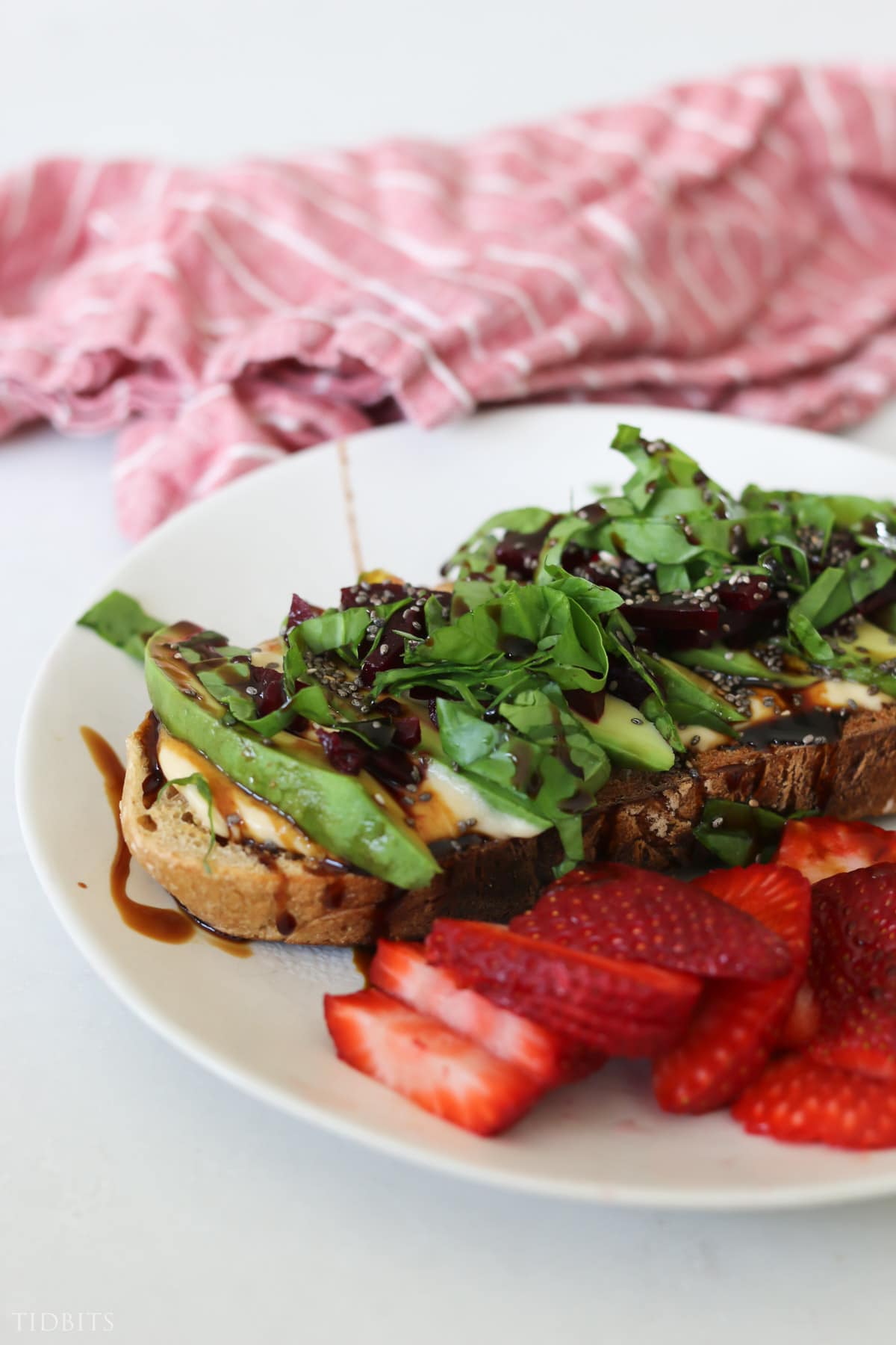 Strawberries and fancy toast topped with vegetables and dressing for dinner