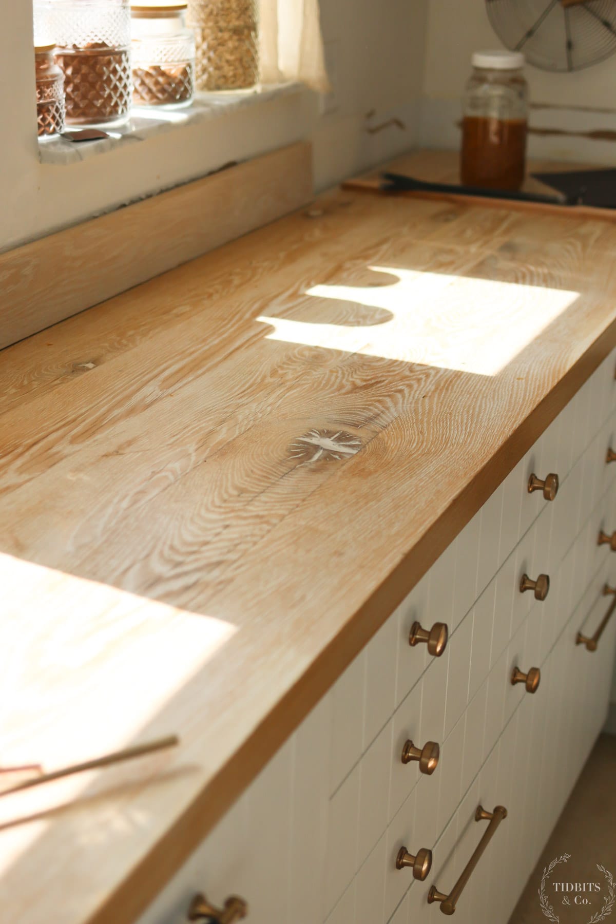 A wood countertop showing yellowing stain