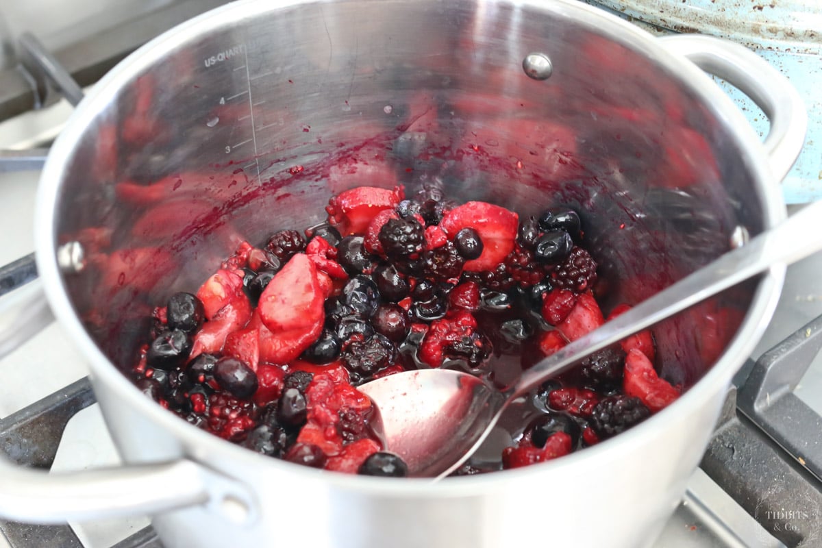 Mixed berries in a metal saucepan