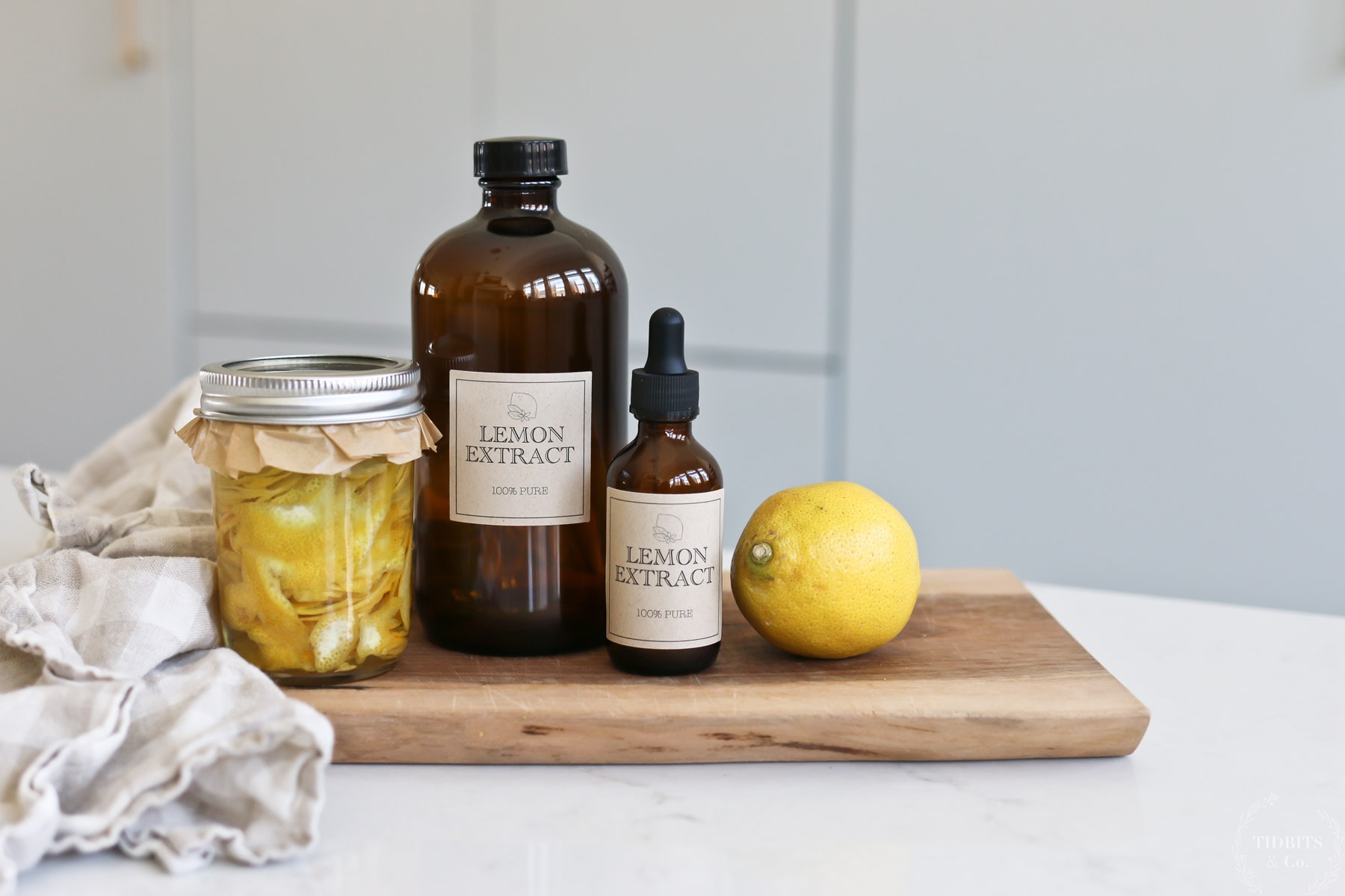 Homemade lemon extract in glass bottles and jars