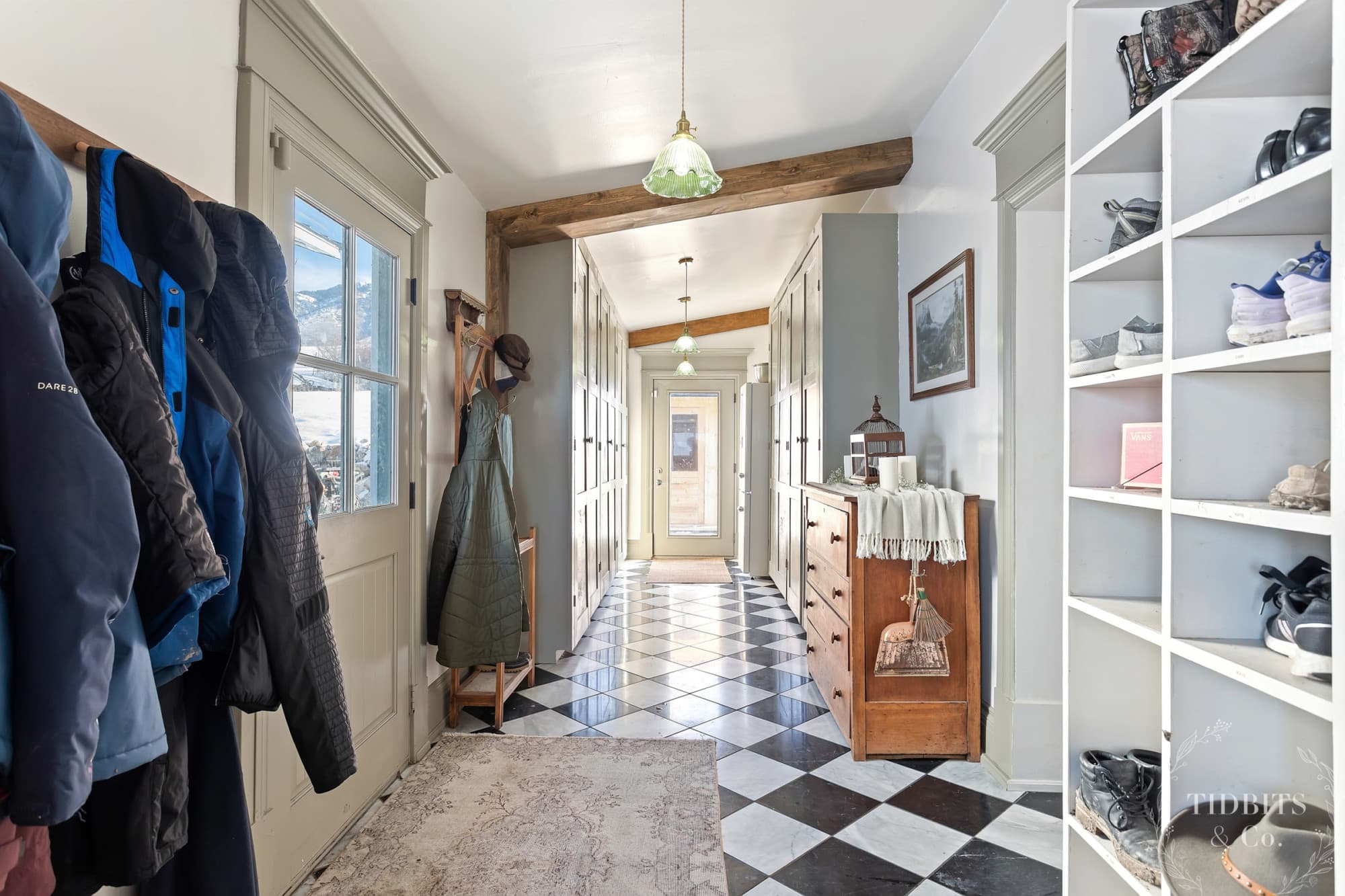 A mudroom in a pole barn house with tall cabinets