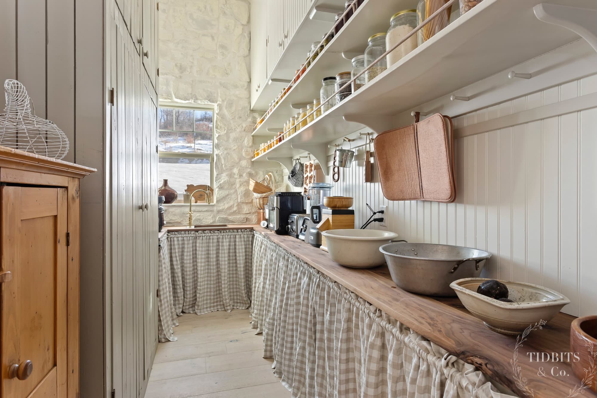 An interior stone wall in a butler's pantry