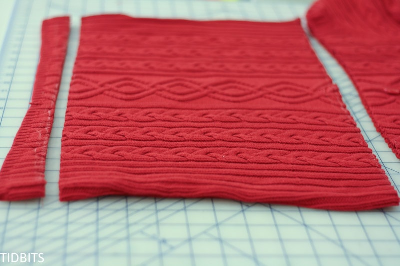Red sweater cut into rectangle for sewing pillow cover