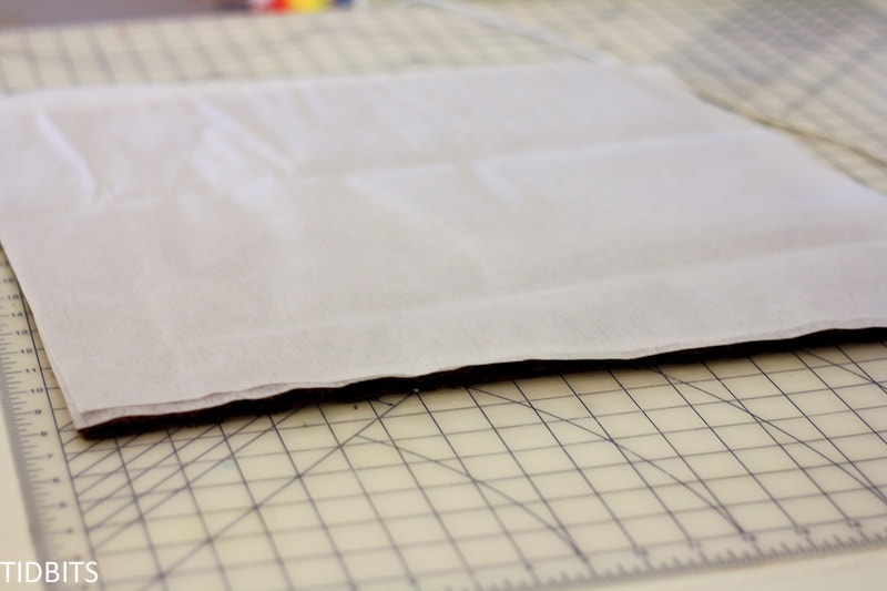 A square of knit fabric with fusible interfacing laid on top
