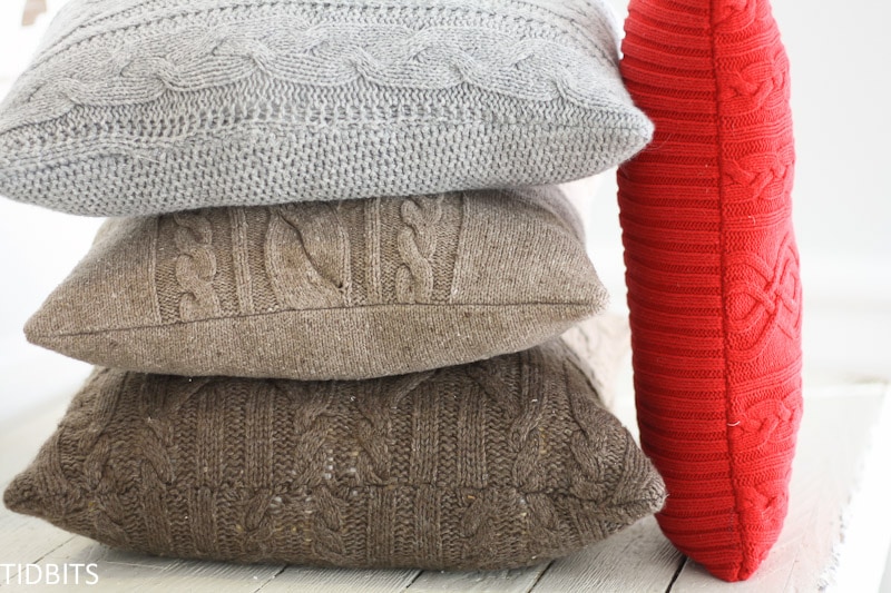 A stack of cozy re-purposed sweater pillows
