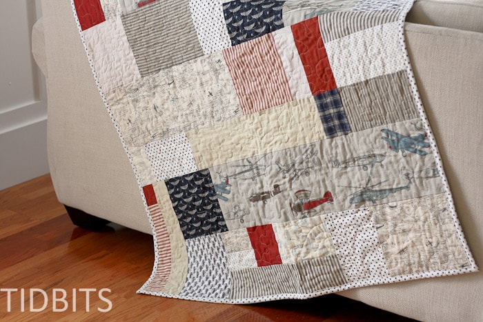 The lazy quilter's easy quilt laying on a couch
