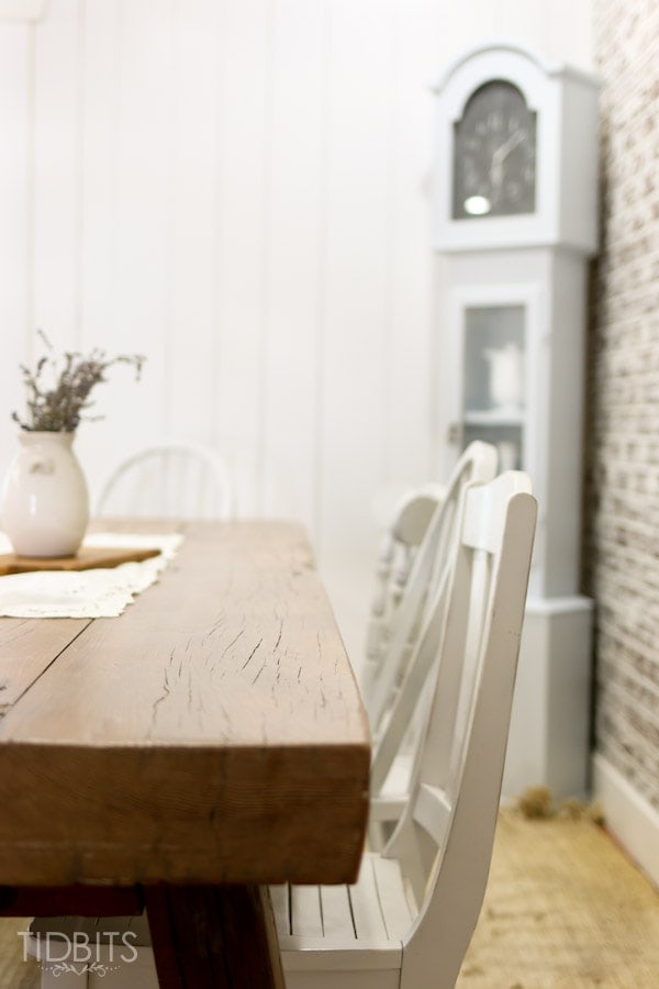 Dining Room with farmhouse table and faux brick wall, by TIDBITS