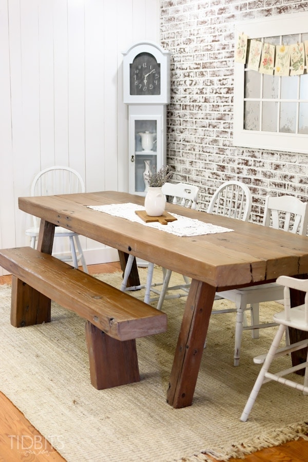 Dining Room with farmhouse table and faux brick wall, by TIDBITS