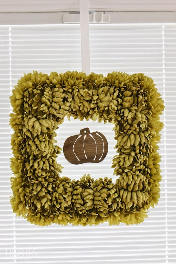 DIY Fall Floral Wreath made from styrofoam and artificial mums.