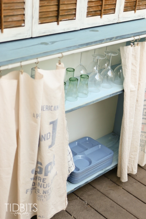 Antique hutch and TV storage.  Deck makeover by TIDBITS.