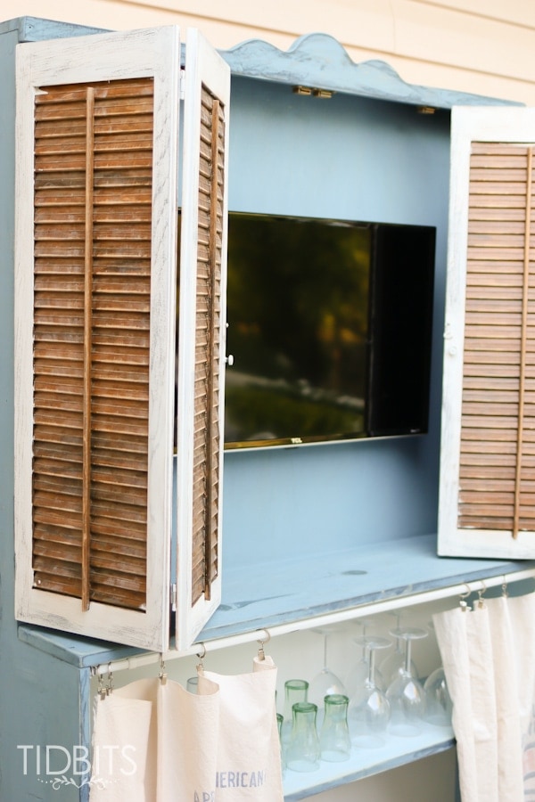 Antique hutch and TV storage.  Deck makeover by TIDBITS.