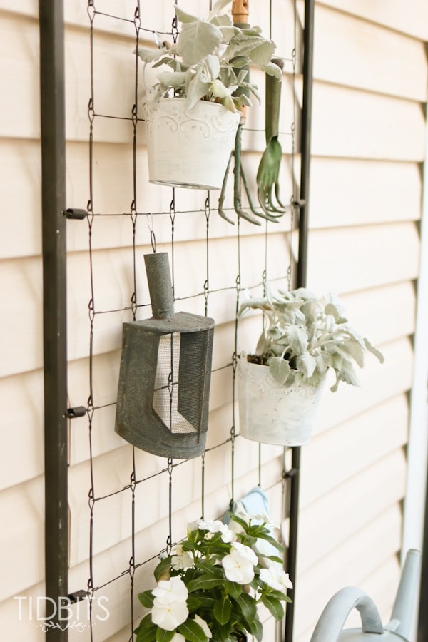Repurposed crib spring.  Used as a garden center and deck decor.