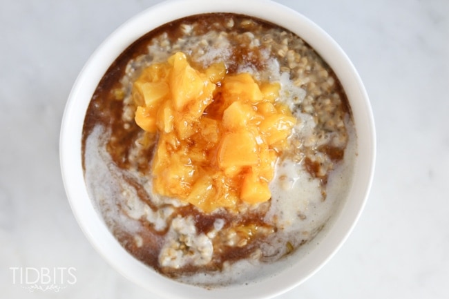 Pressure cooker or slow cooker peaches and cream steel cut oats, with a cinnamon maple drizzle.