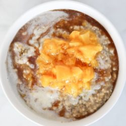 Pressure cooker or slow cooker peaches and cream steel cut oats, with a cinnamon maple drizzle.