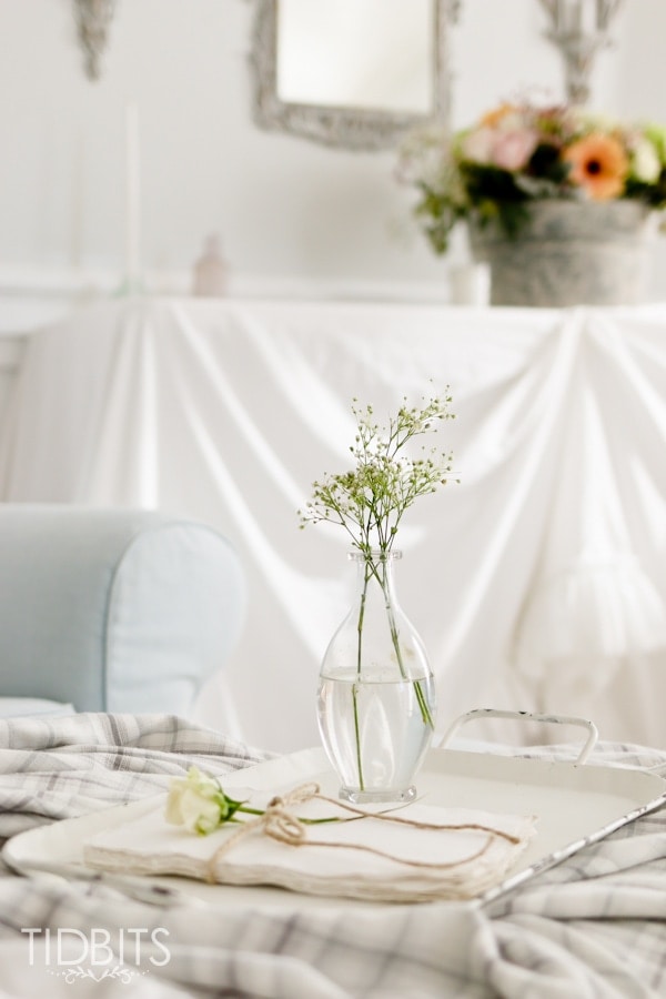 DIY Ruffle Tablecloth from cotton sheets - turn your inexpensive fold up tables into lovely accent tables.