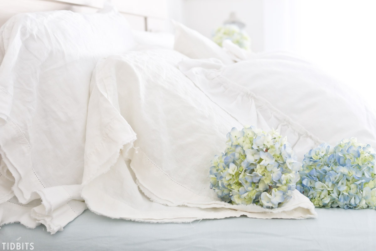 soft blue hydrangeas and linen sheets