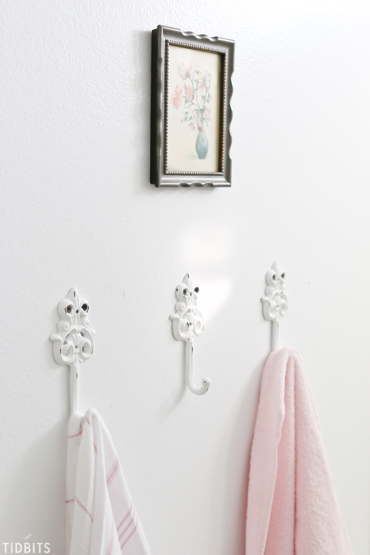 French Cottage Bathroom Spring refresh for family closeup of towel hangers and towels