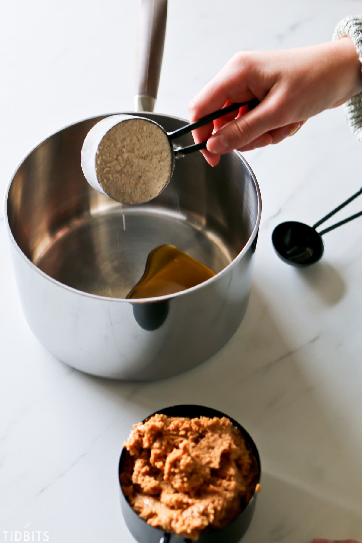mixing whole wheat flour with the maple syrup