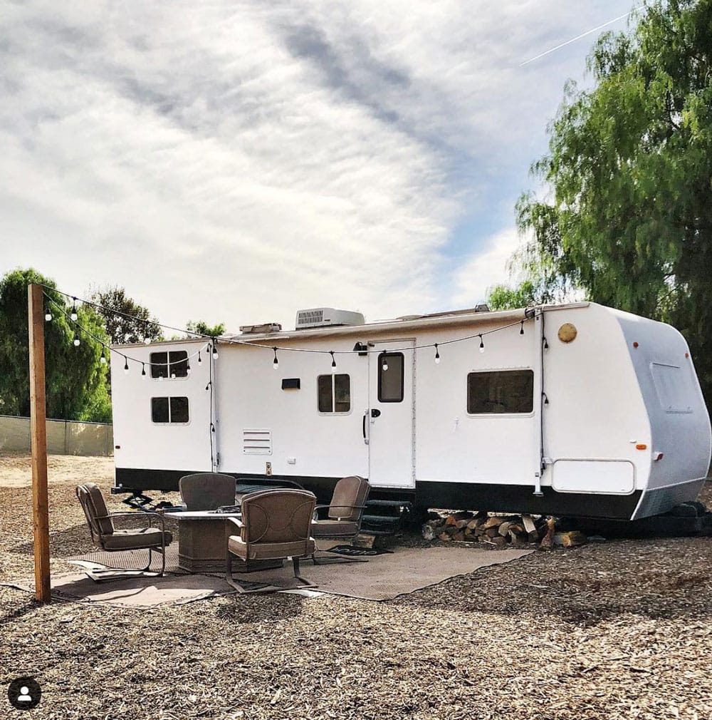 outside of rv, with lights and eating area