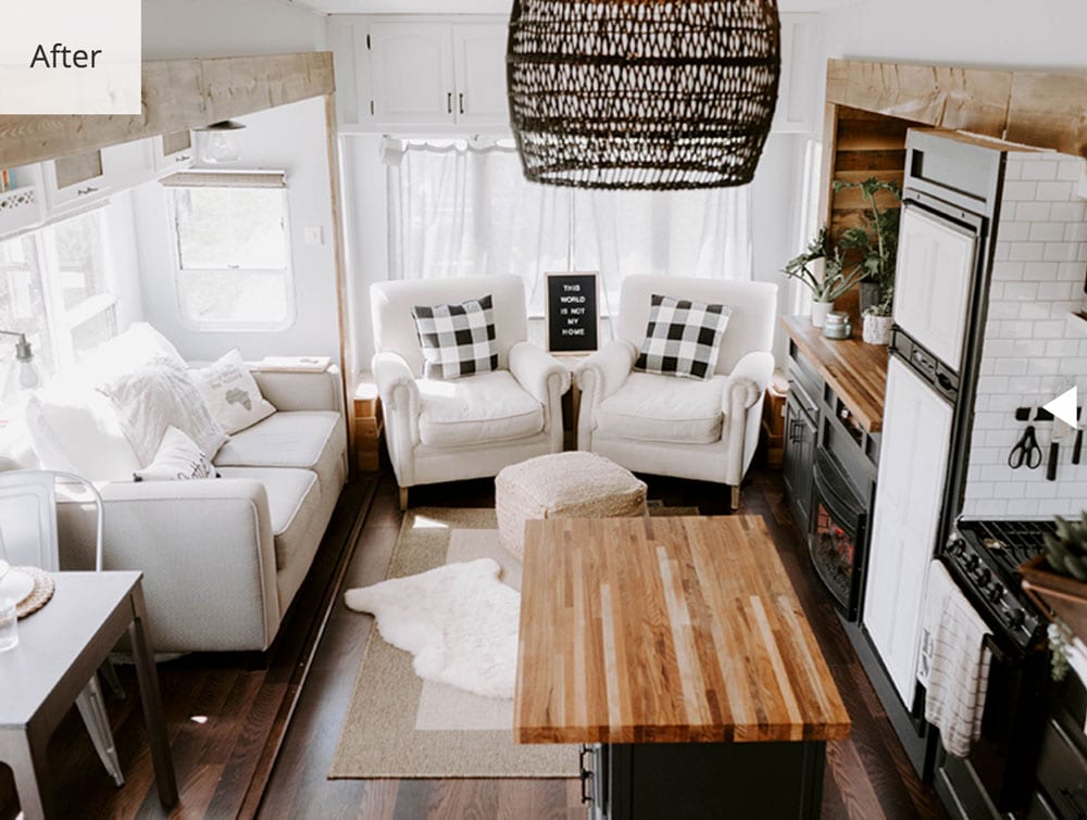 living room with chairs and couch next to kitchen area in an rv
