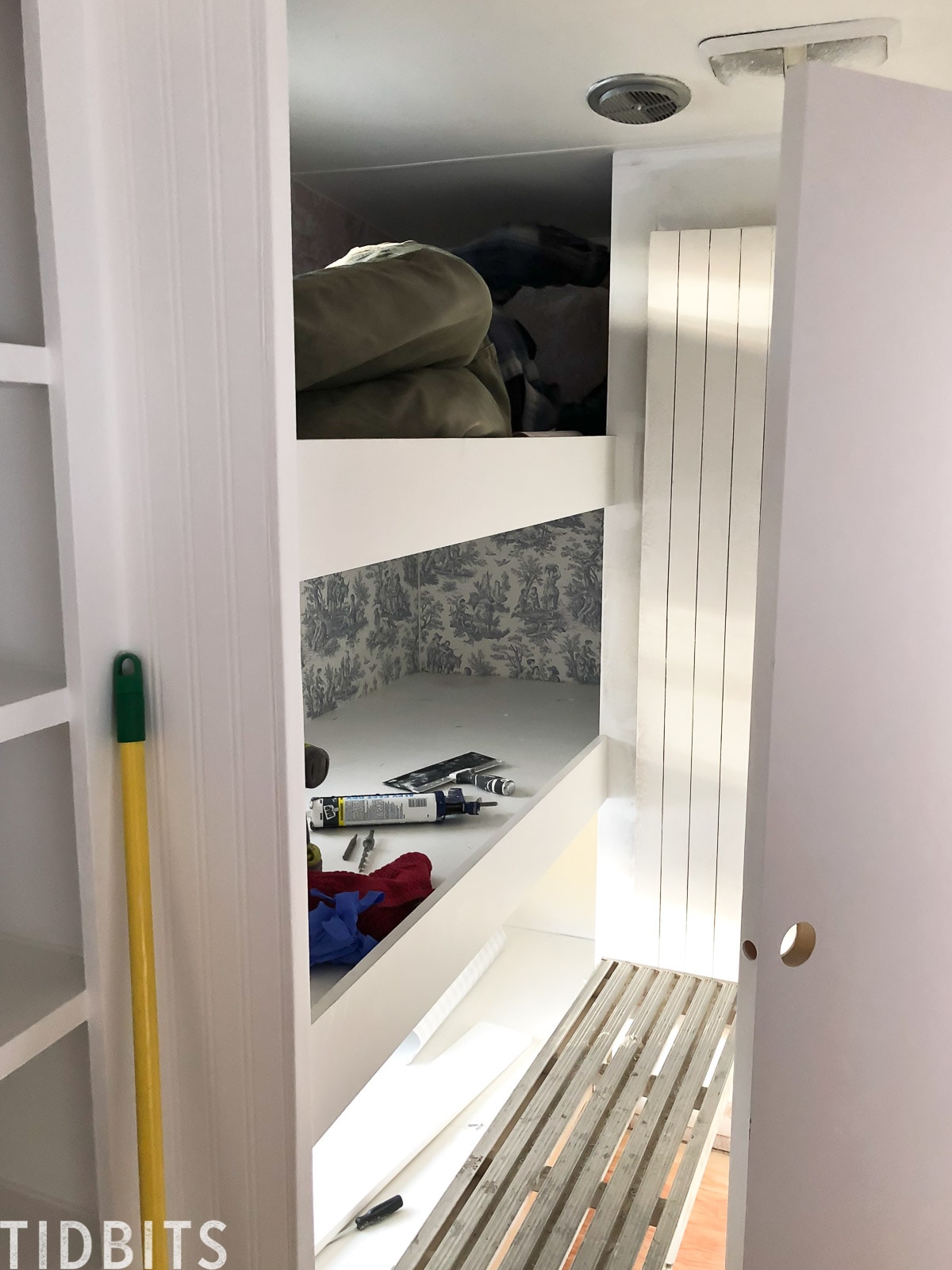 Applying wallpaper in RV bunk area