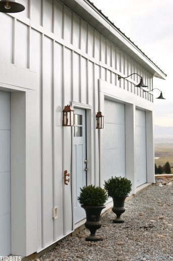 Painted garage doors, steel siding and roofing, pole barn home.