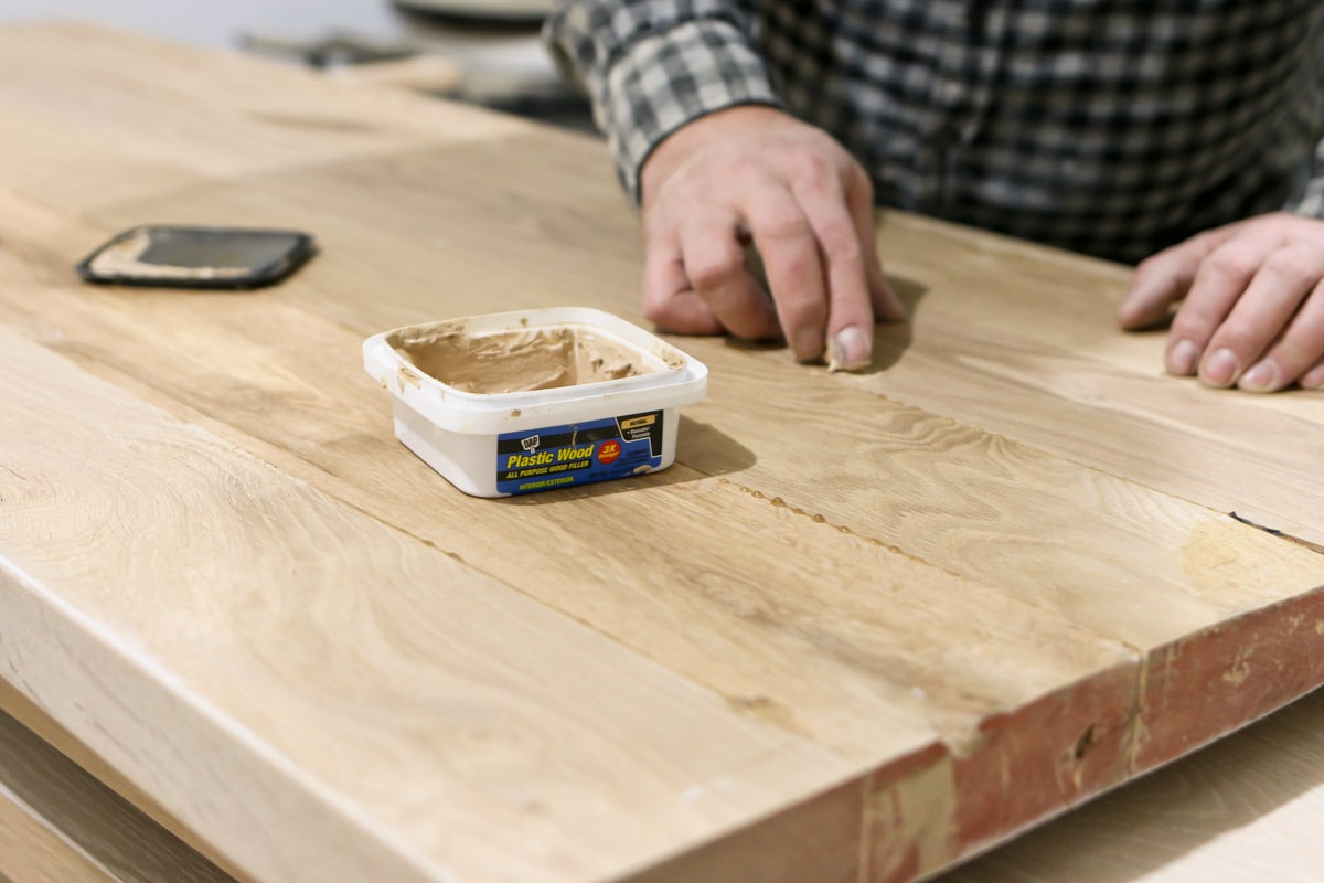 filling the holes of the wood with filler
