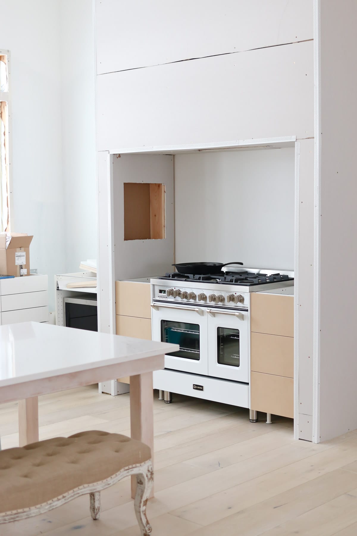 overview of the kitchen stove with brown cabinet storage on each side