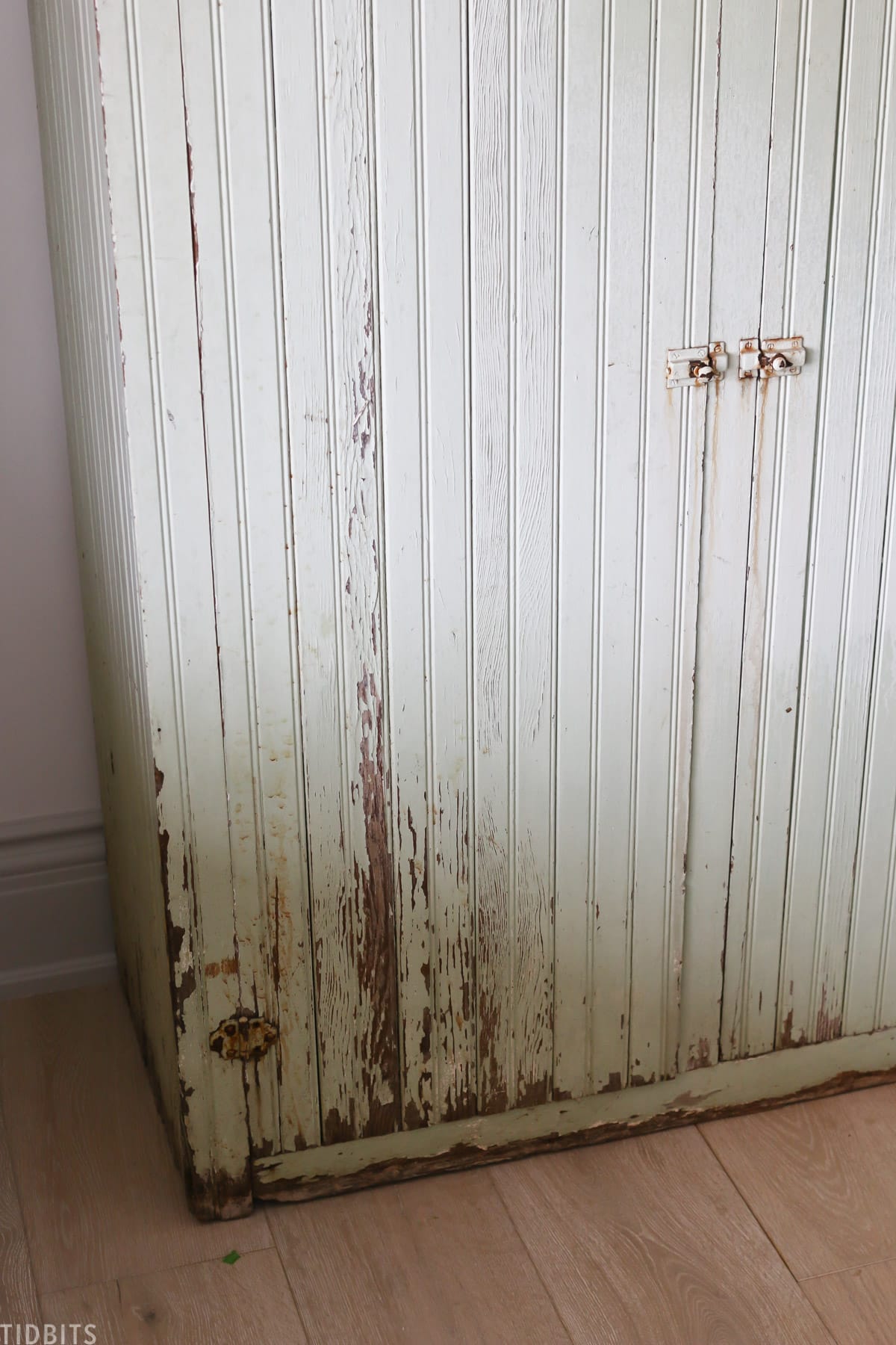 chipping paint on antique cabinet
