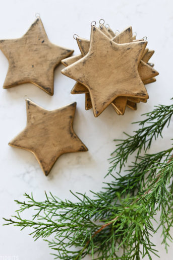 golden Christmas stars laid out across countertop
