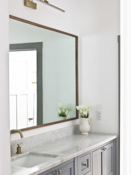 DIY mirror frame above bathroom vanity