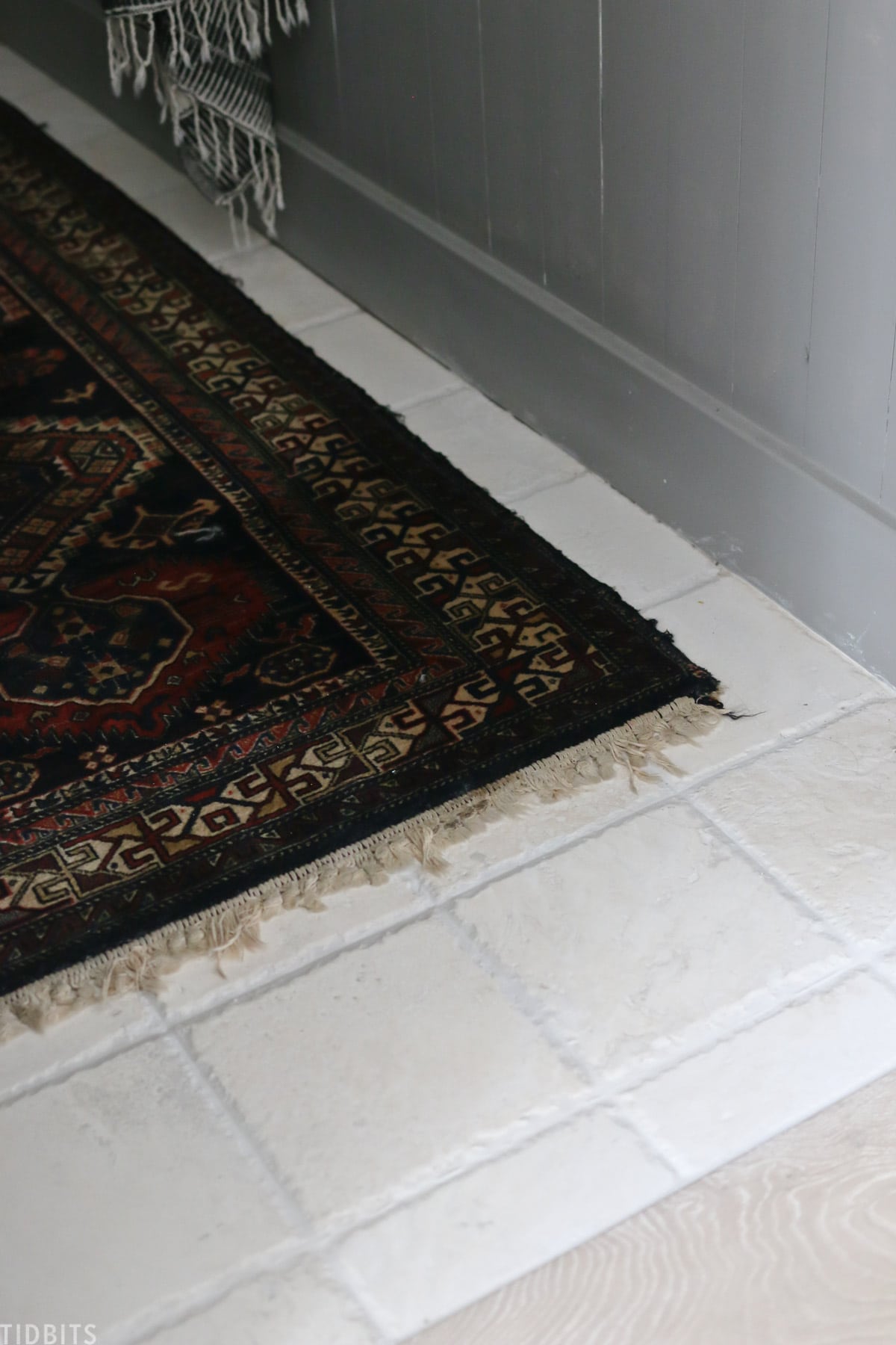 antique rug placed on floor in split bathroom